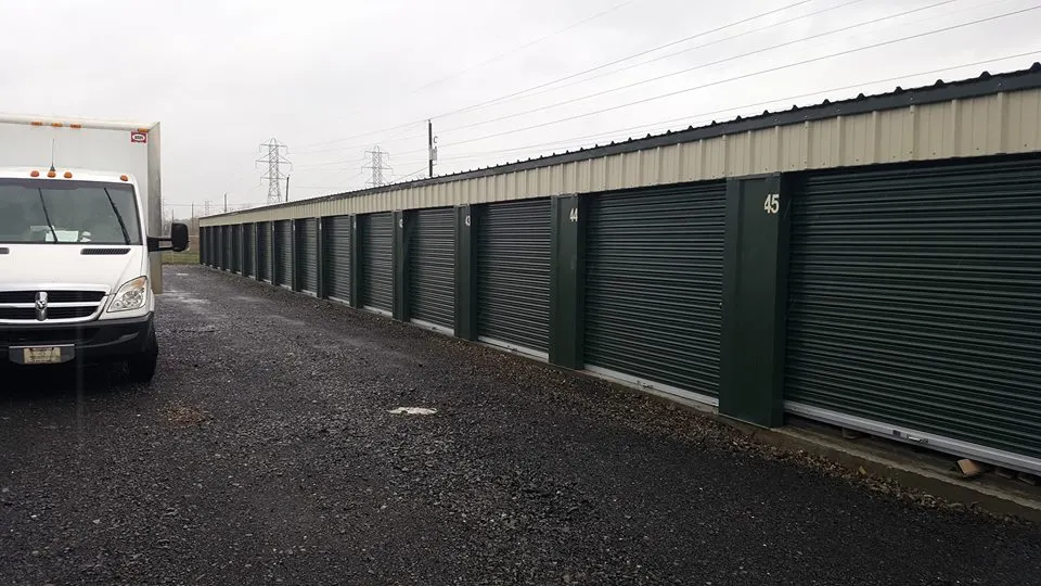 Easy Move truck parked in front of a row of storage units — real photo